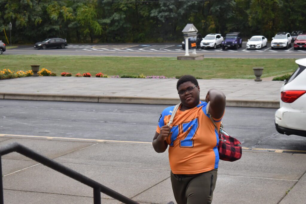 student wearing Catskill shirts