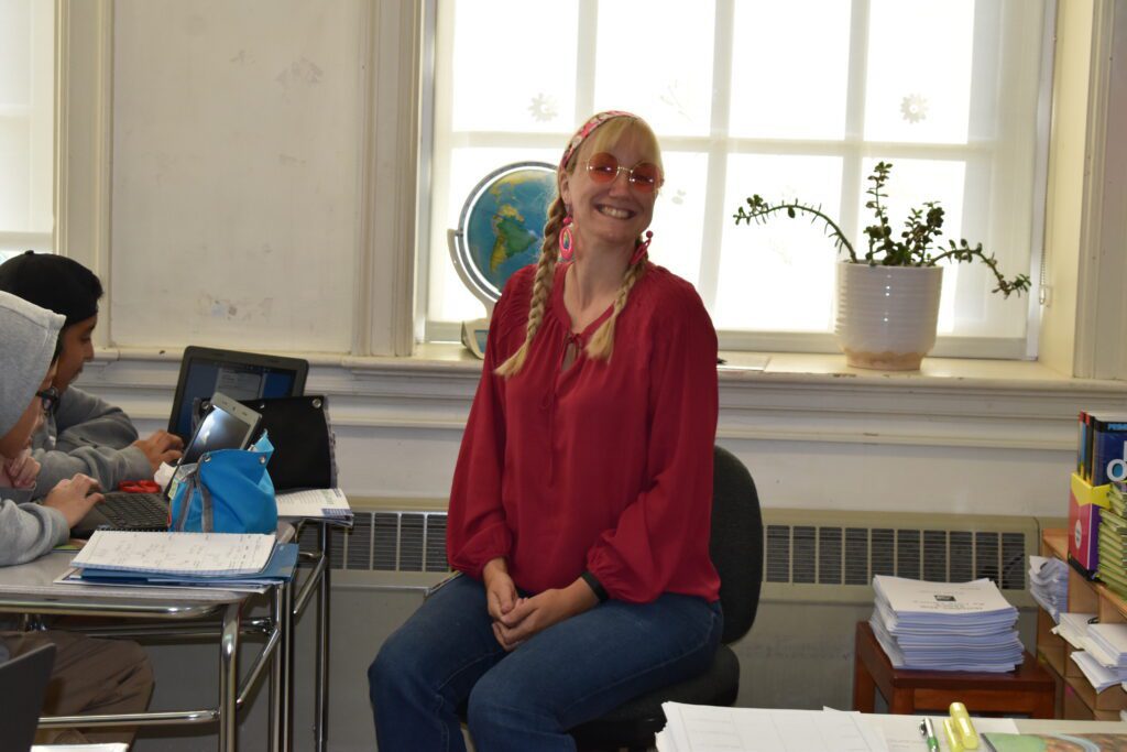 teacher dressed in seventies style clothing