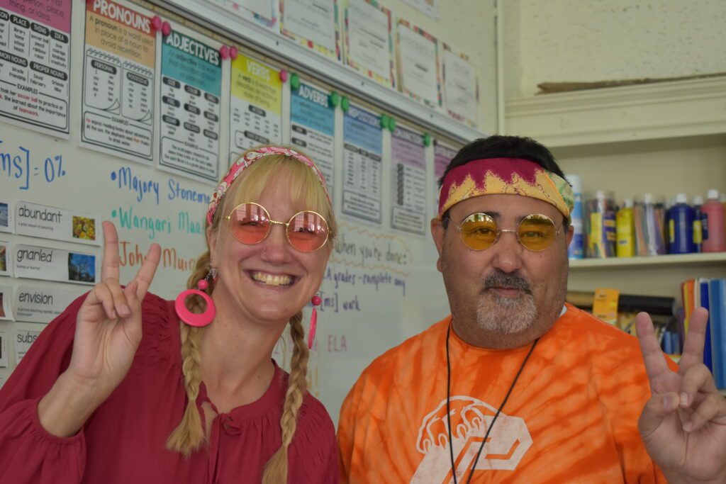 Woman and man dressed in seventies style clothing