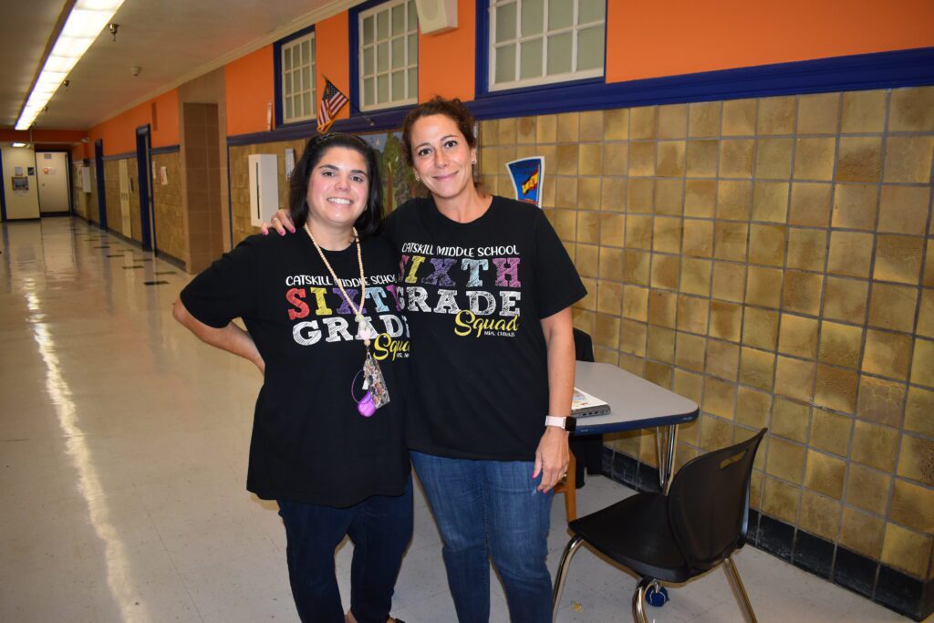 two women wearing the same shirt