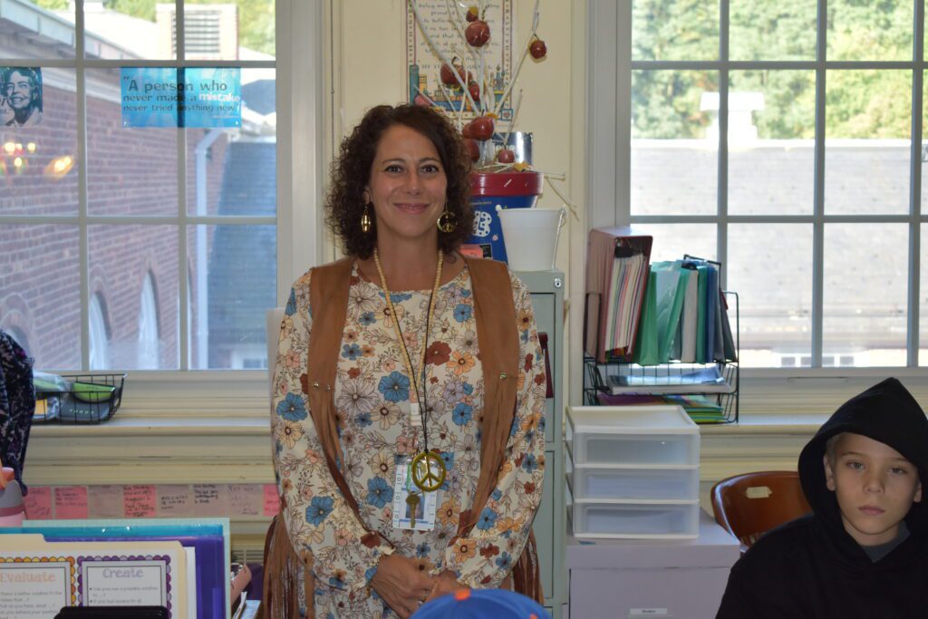 teacher dressed in seventies style clothing