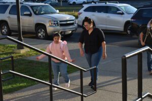 girl walking up to school