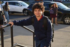 boy walking up to school