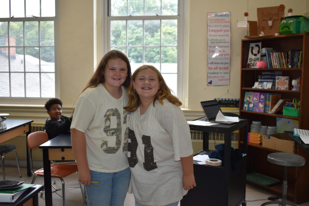 two girls wearing the same shirt