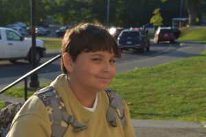 boy walking up to school