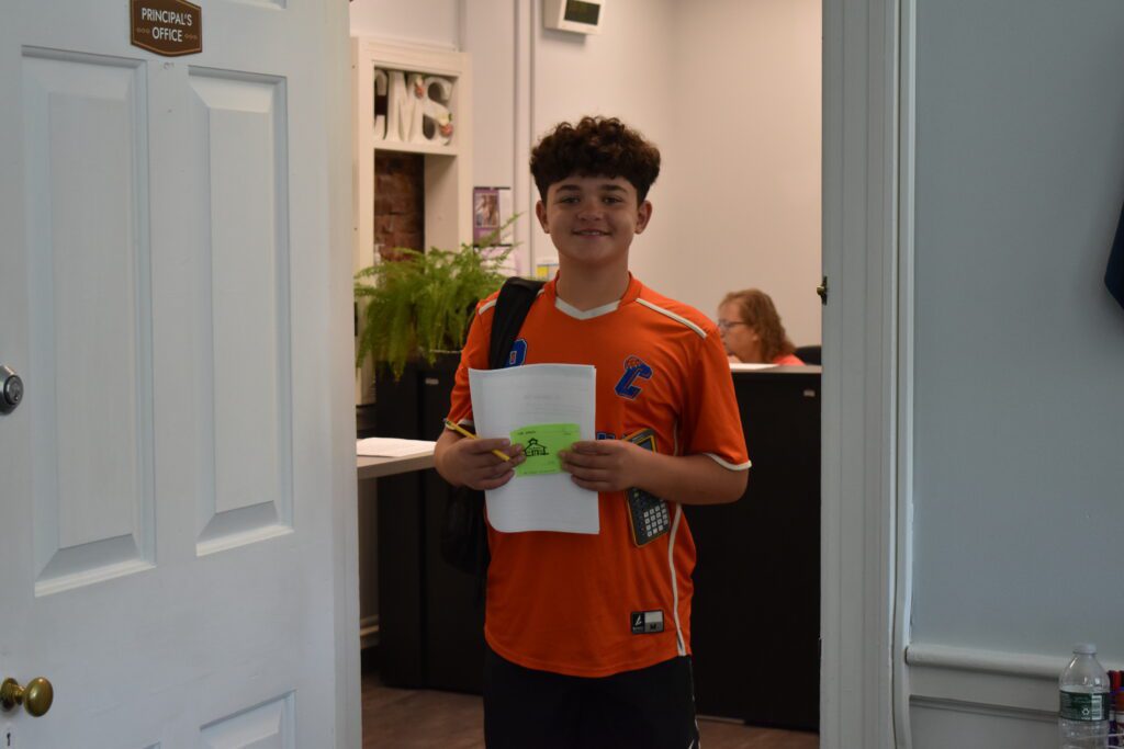 student wearing Catskill shirts