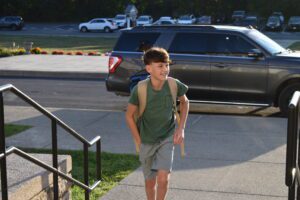 boy walking up to school