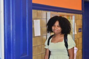 girl walking in hallway