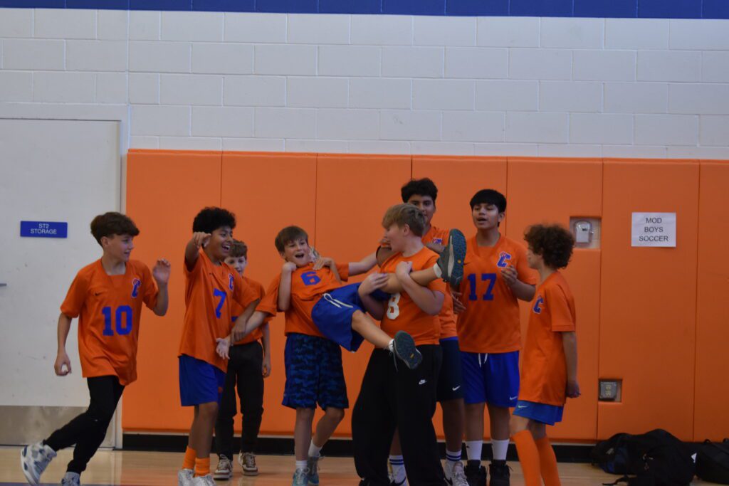 boys lifting up one of their own