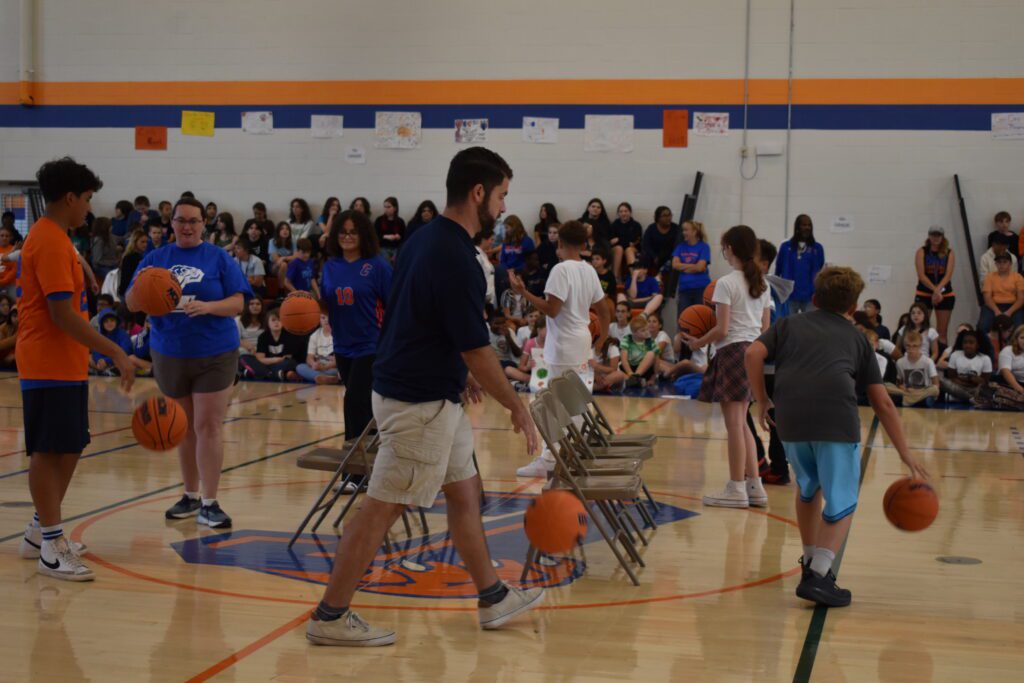 students playing musical chairs