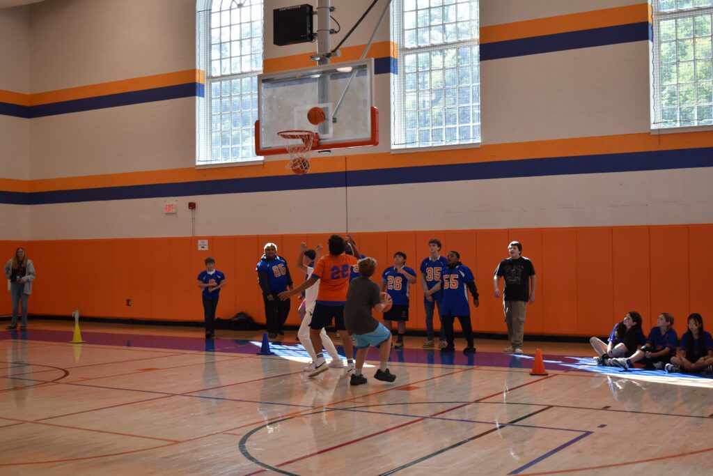 students playing basketball