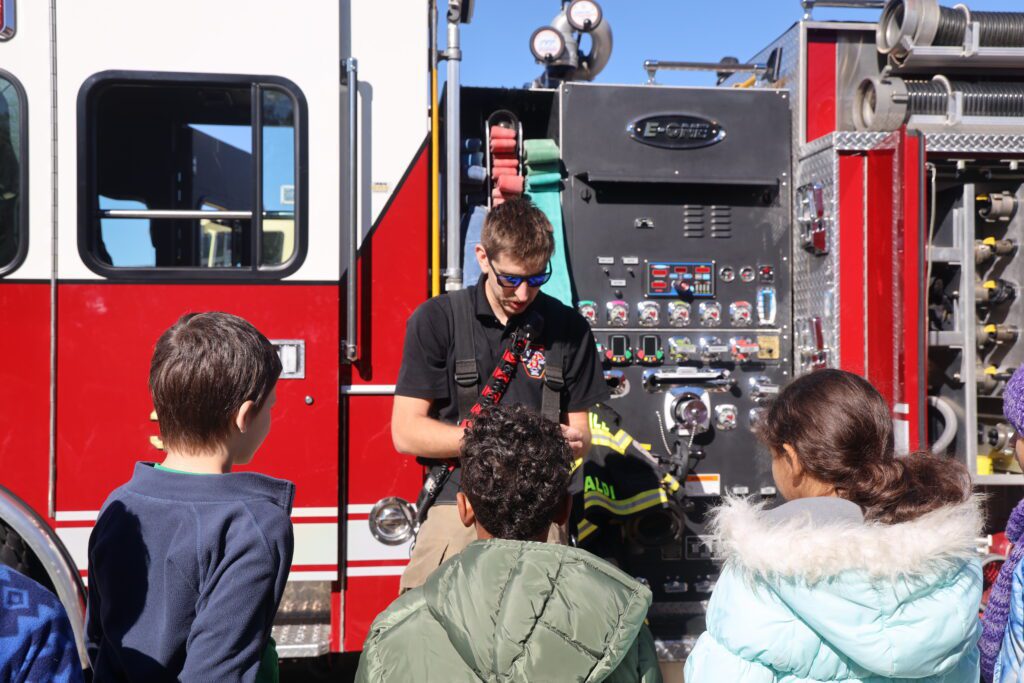 fireman showing students equipment