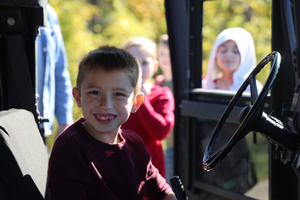 boy smiling inside vehicle