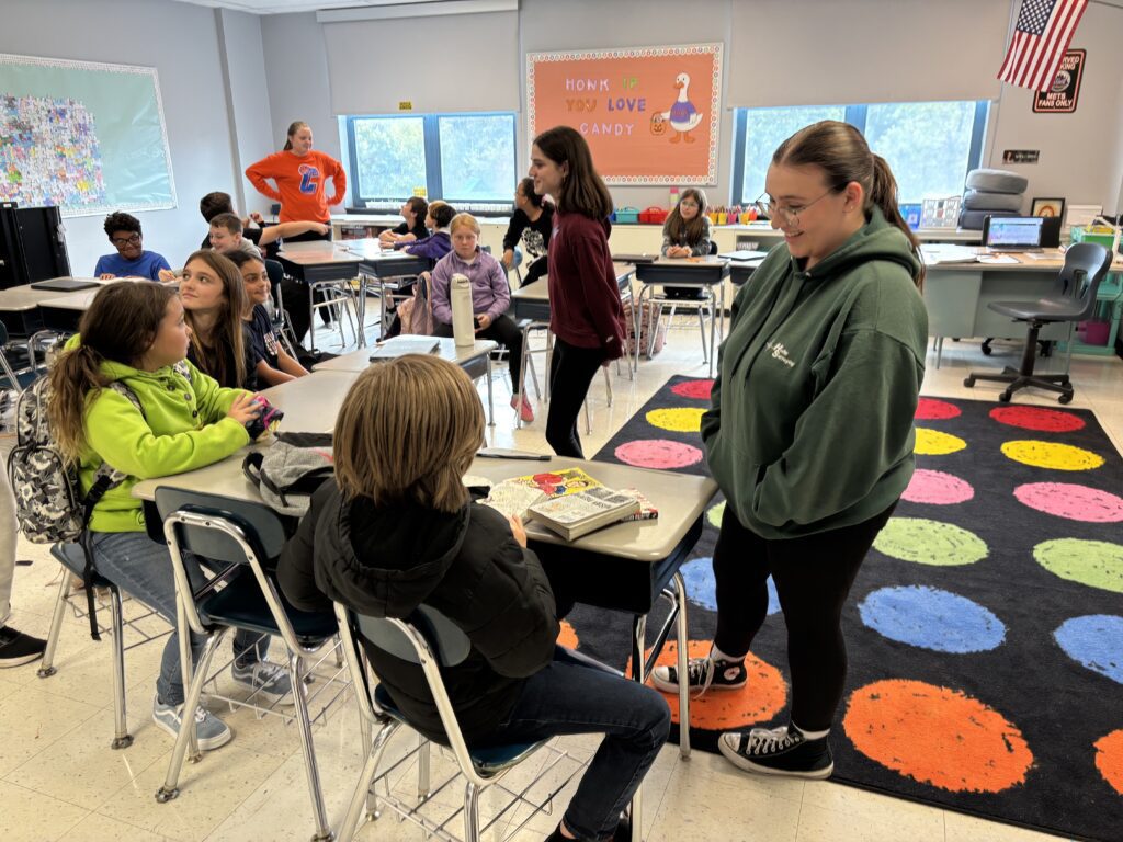high school students in elementary school classroom