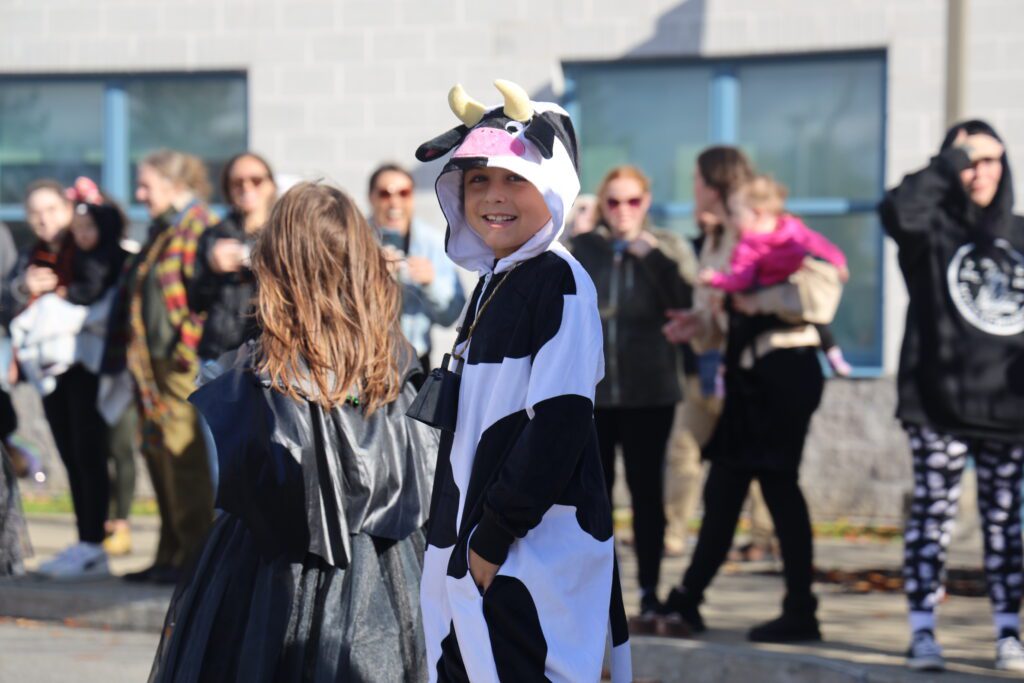 students parade in costumes