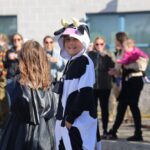students parade in costumes