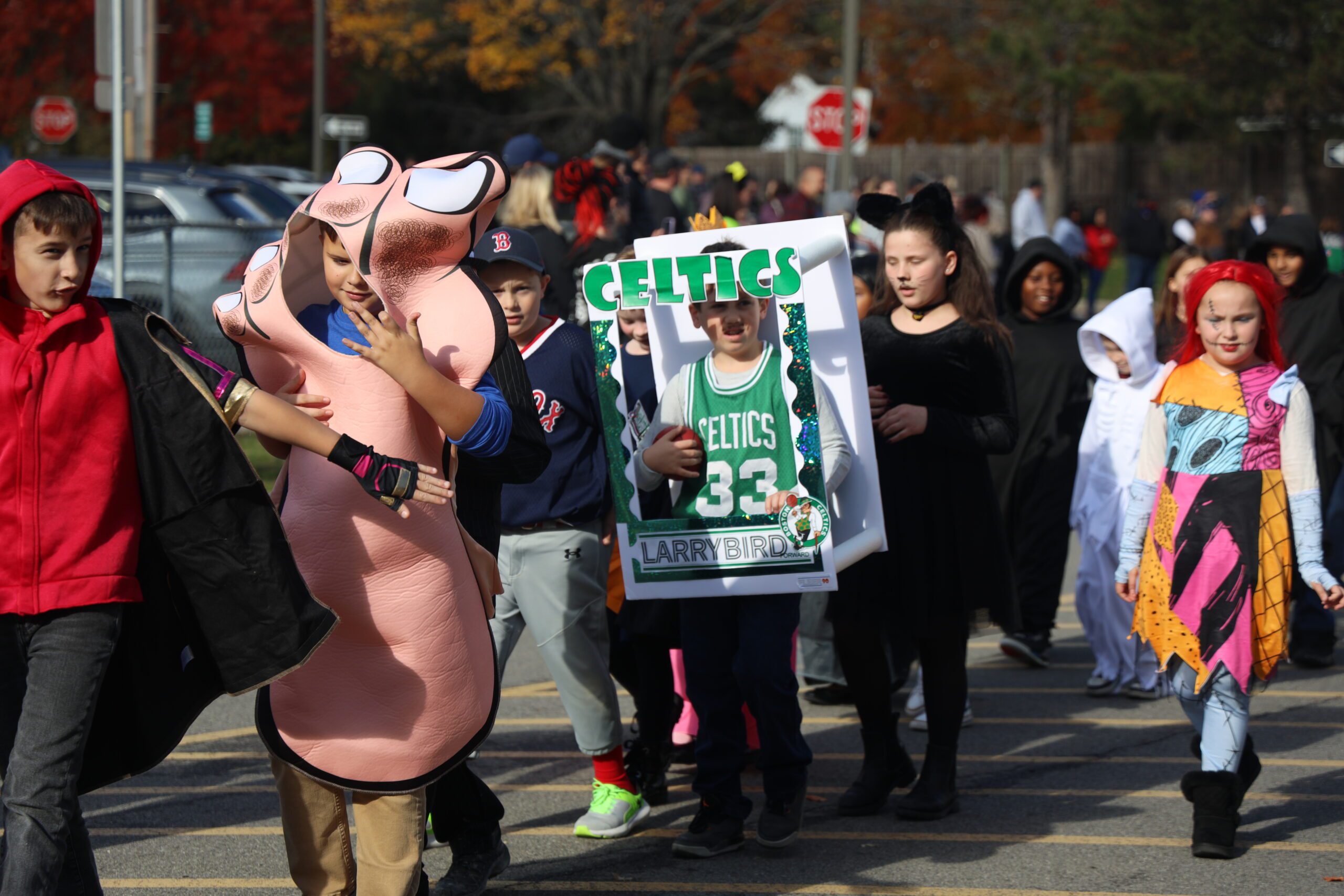students parade in costumes