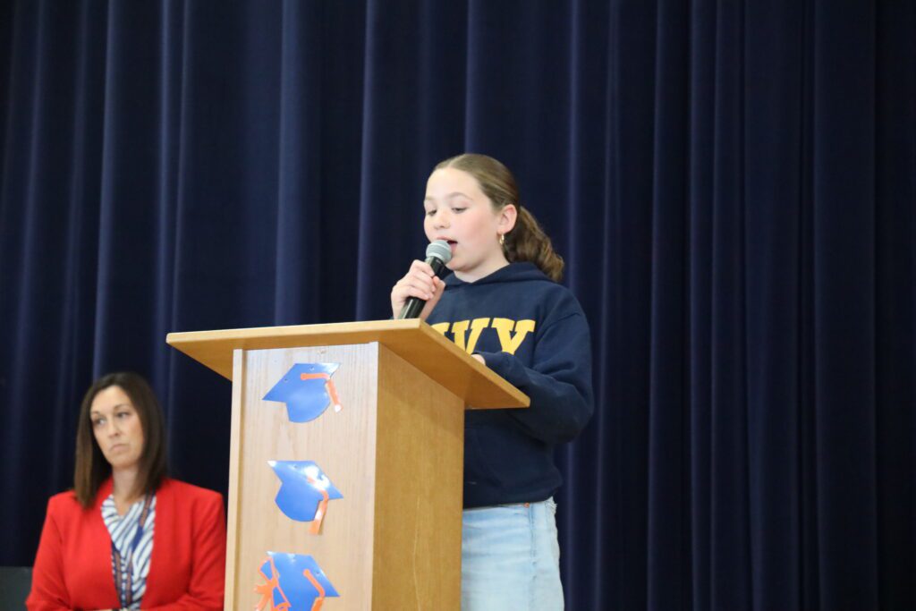 girl speaking at podium