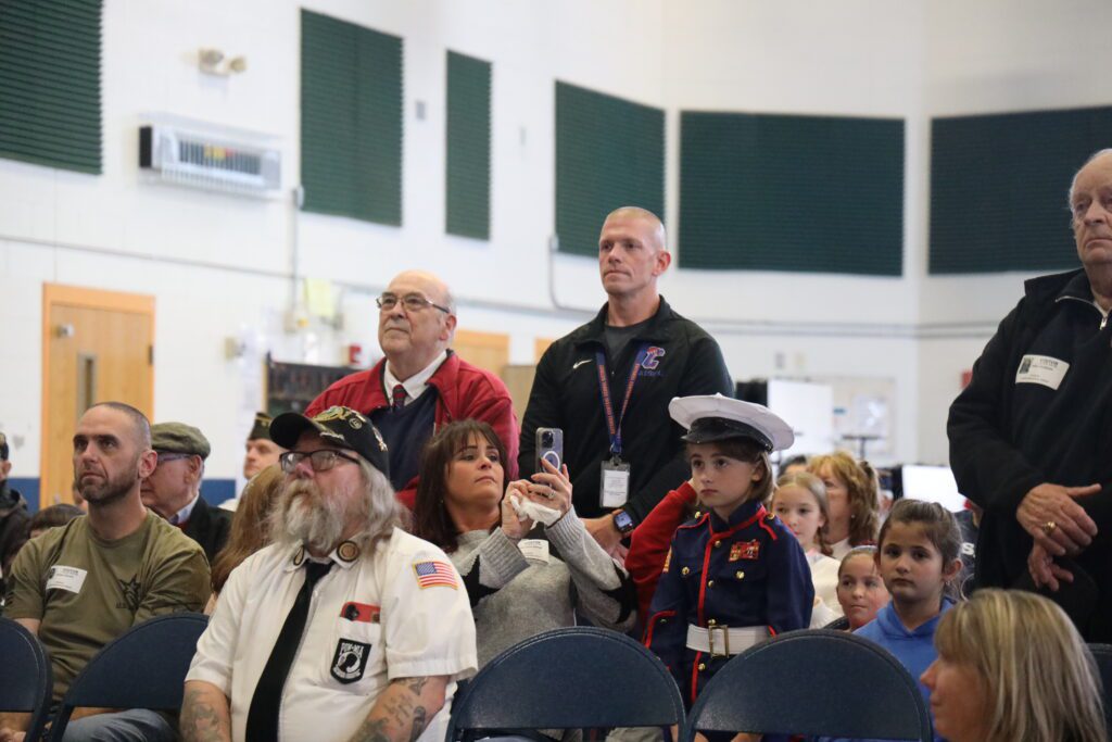 veterans standing in audience