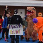 Students parade in costumes on the school track