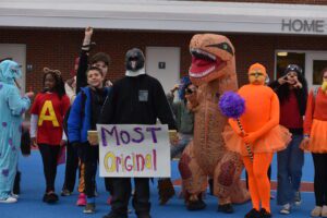 Students parade in costumes on the school track