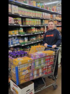 boy pushing shopping cart