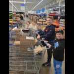 students shopping in grocery store.