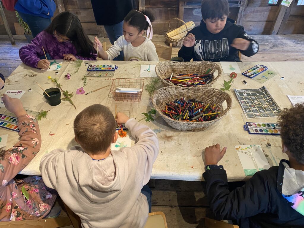 students creating art at table