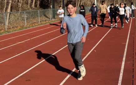 students running on track