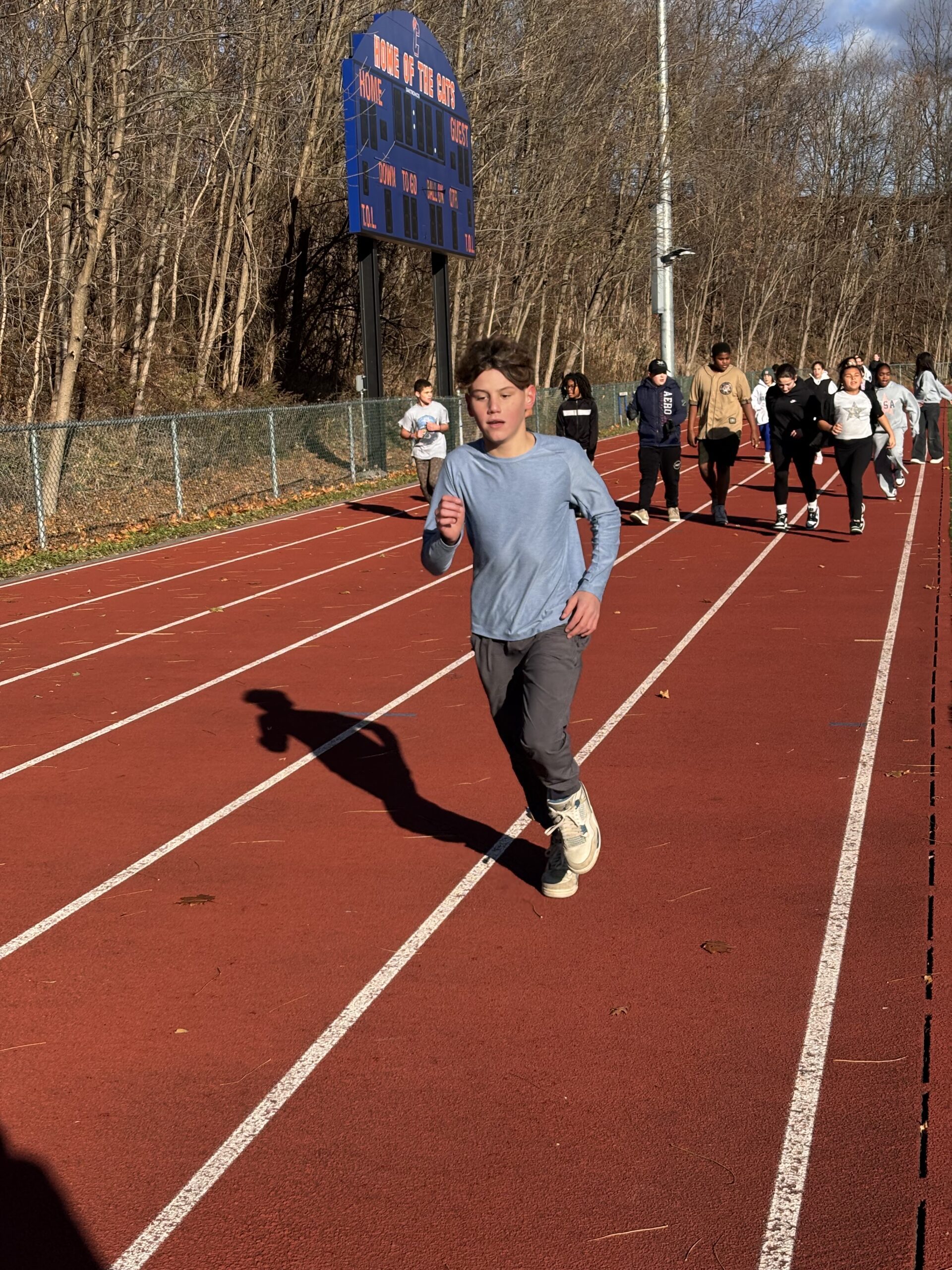 students running on track