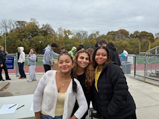 three girls posing for photo