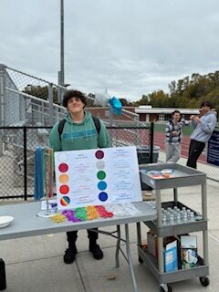 student standing at table