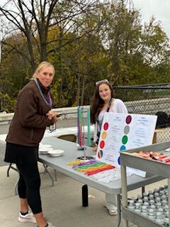 two women standing at table