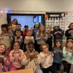 Students pose for class photo with Wonka Bars