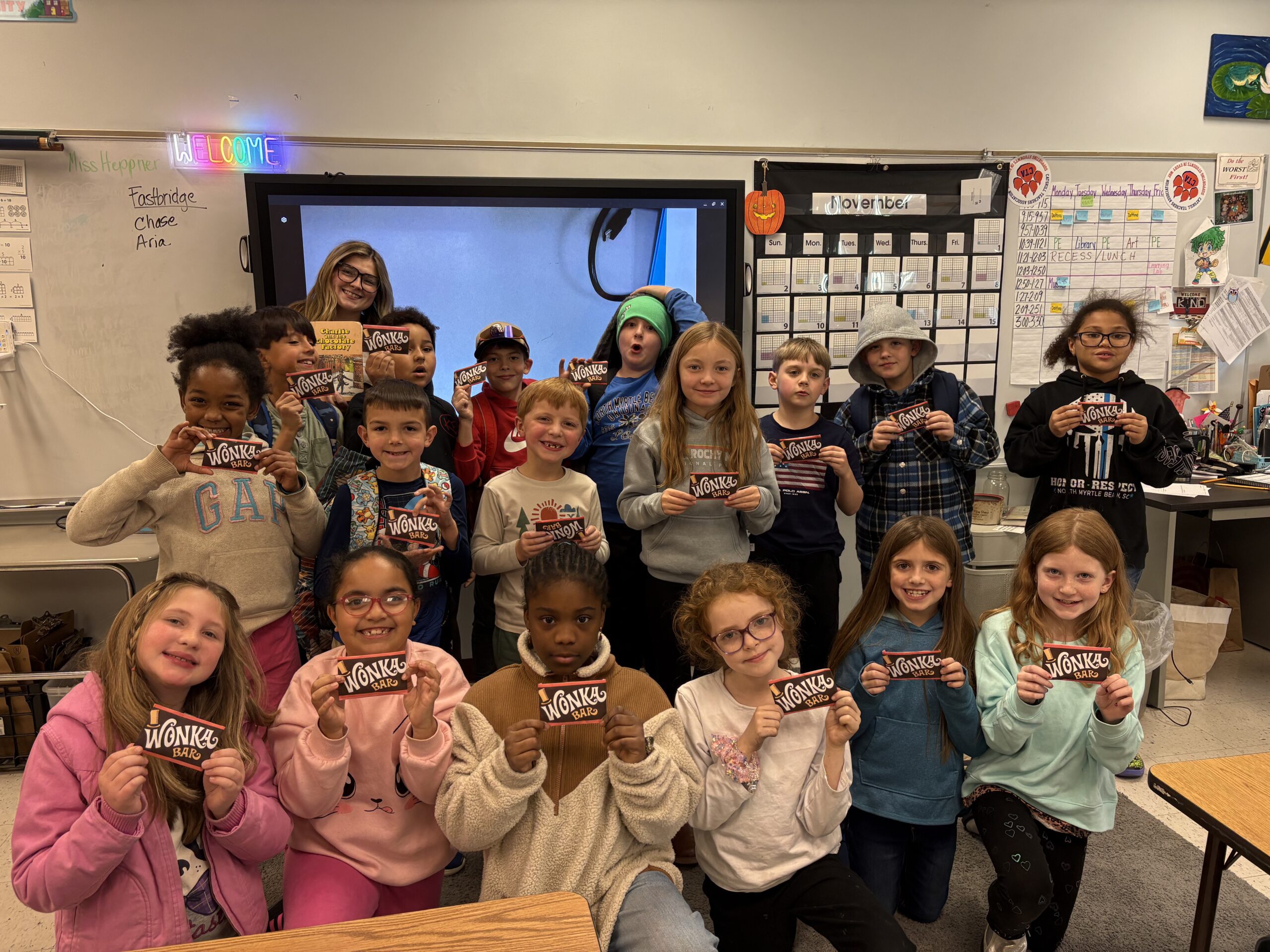 Students pose for class photo with golden tickets