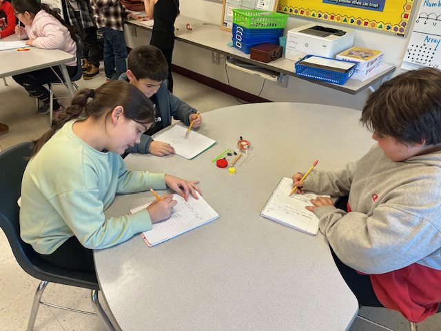 students designing miniature wheeled cart