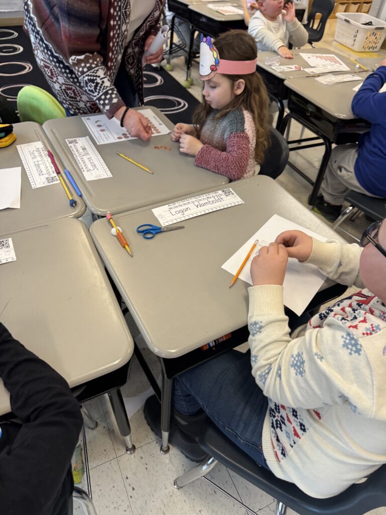 girl looking at coin