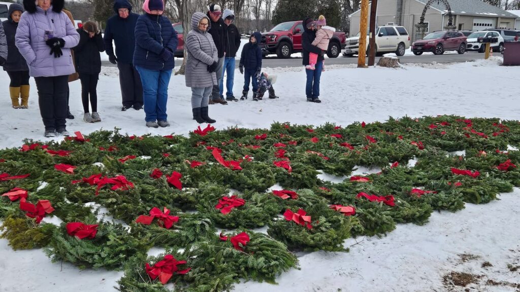 wreathes laid out in the snow