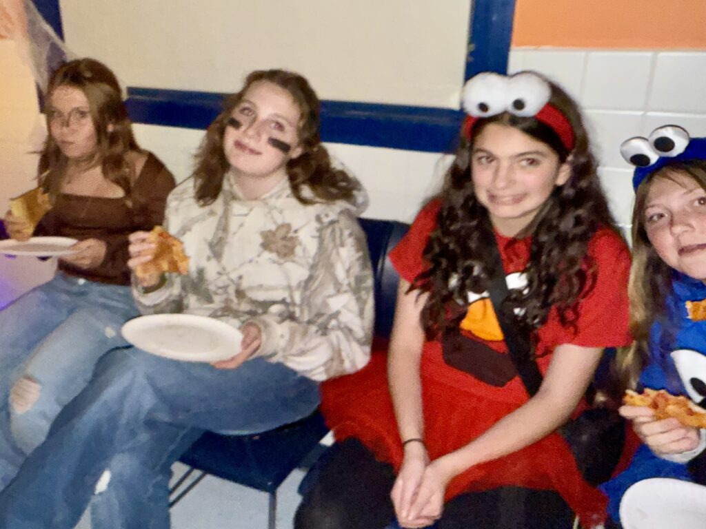 girls sitting and smiling