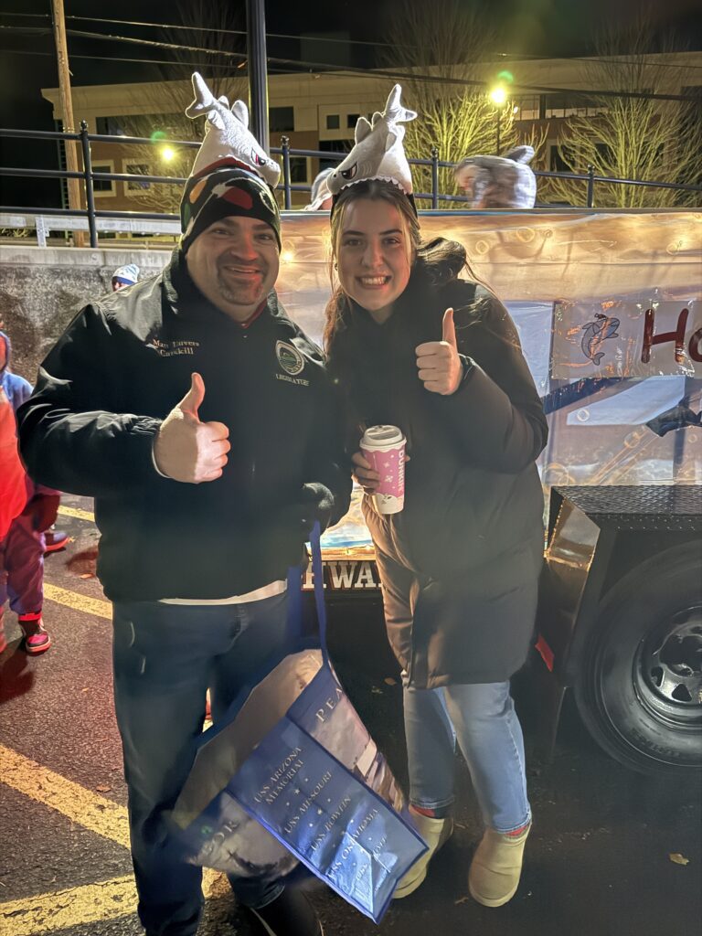 man and woman giving thumbs up