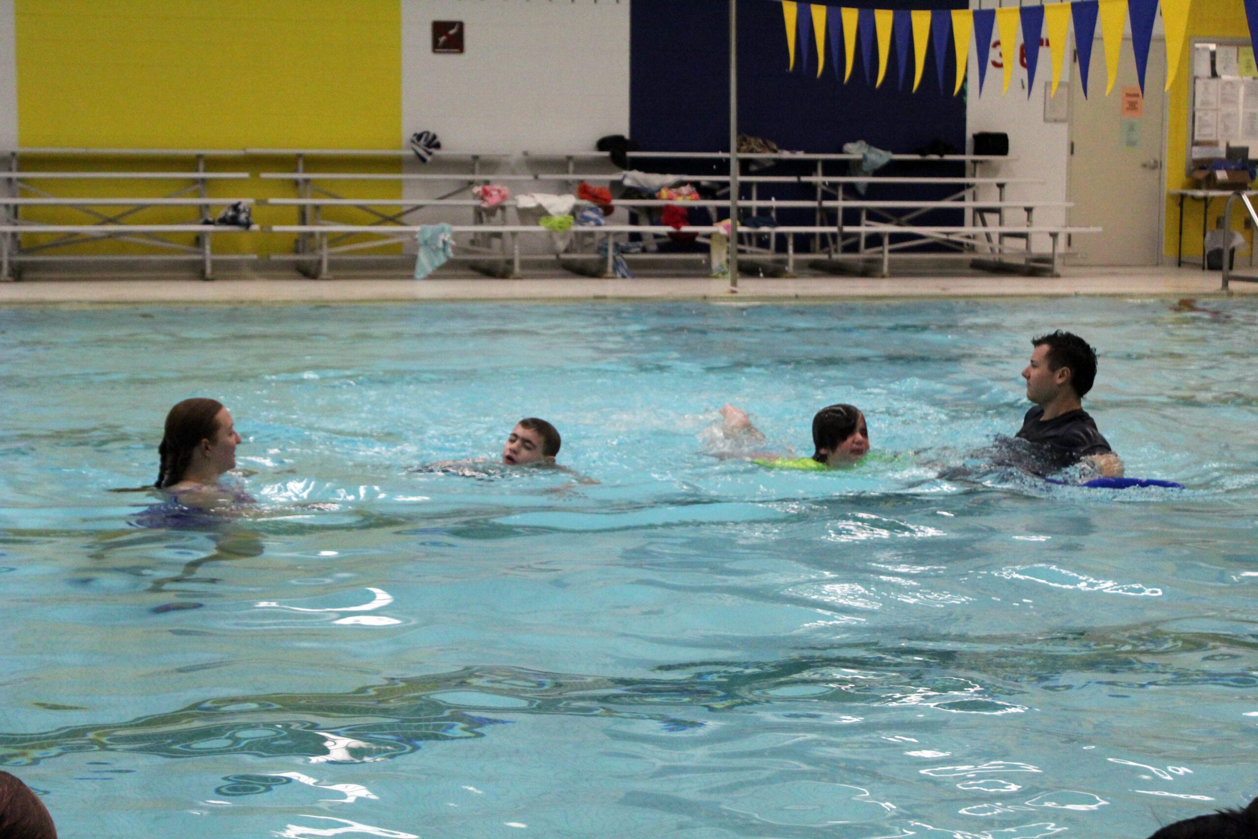 students and teachers swimming