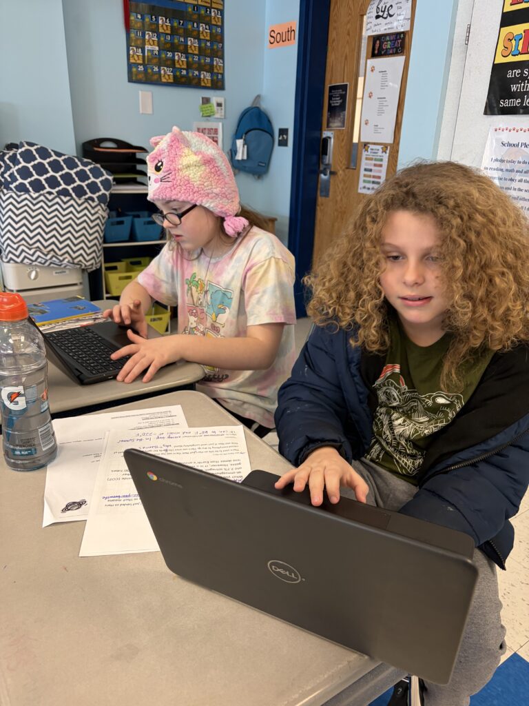 students on laptop computers