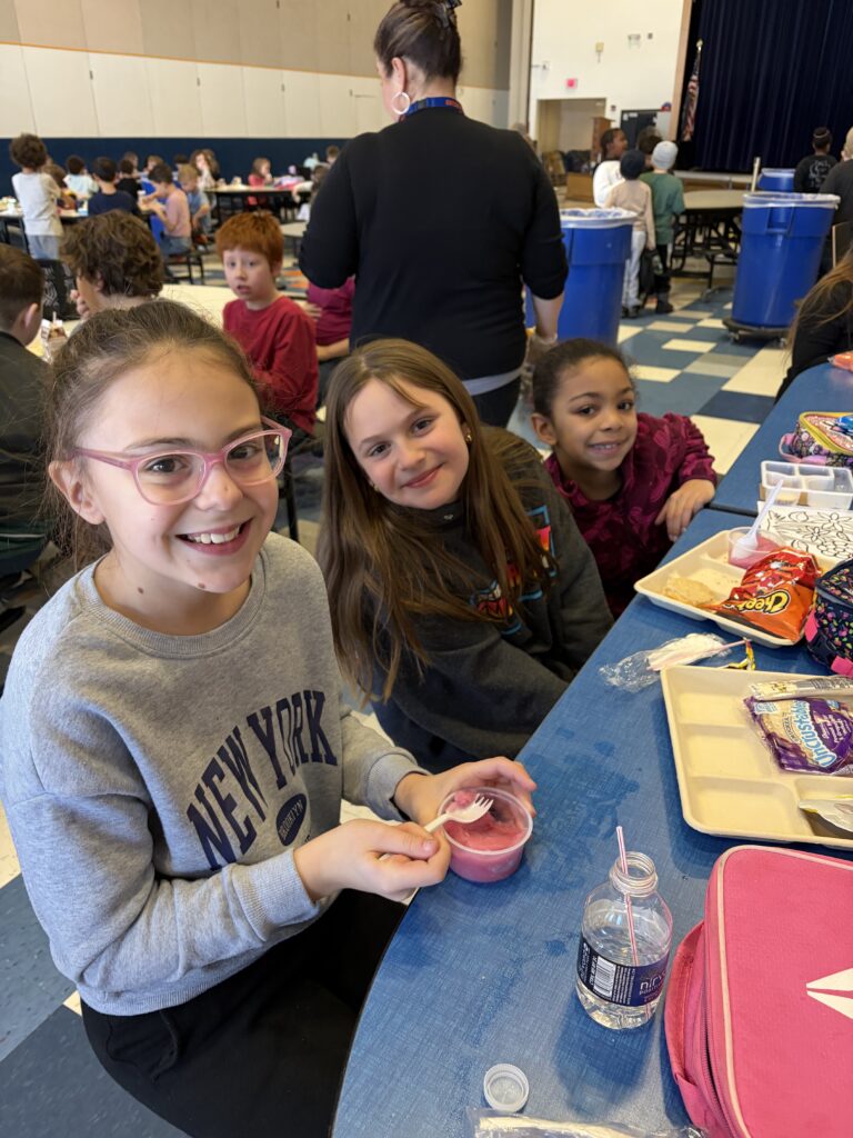 students eating lunch in cafeteria