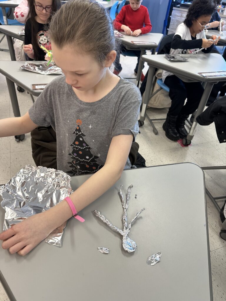 student making skier model