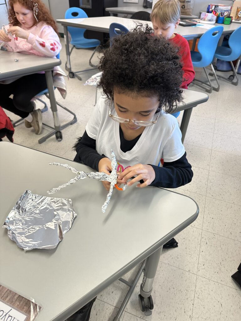 student making skier model