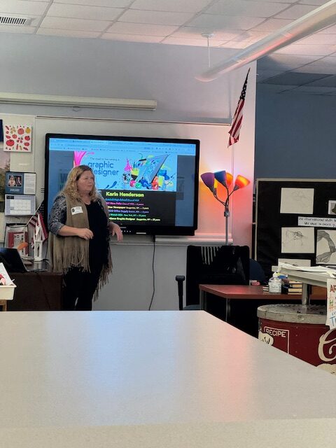 woman giving presentation to students