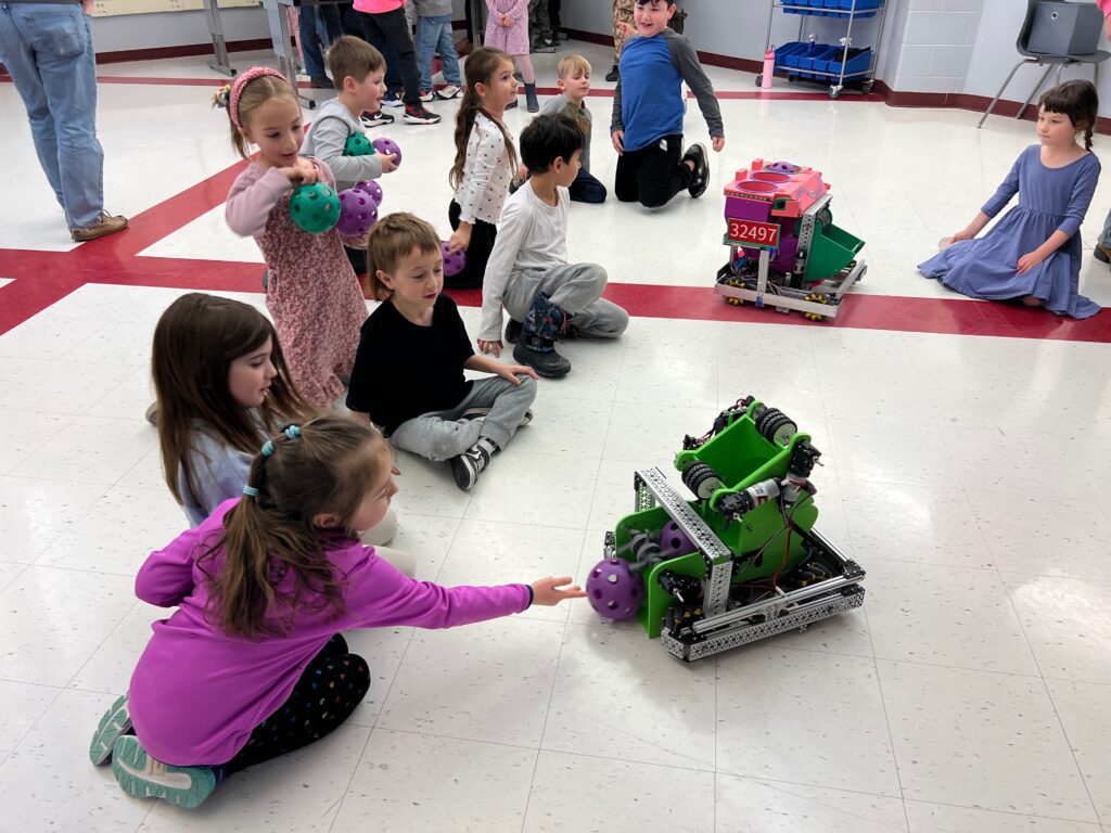 students playing with robots