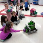 students playing with robots