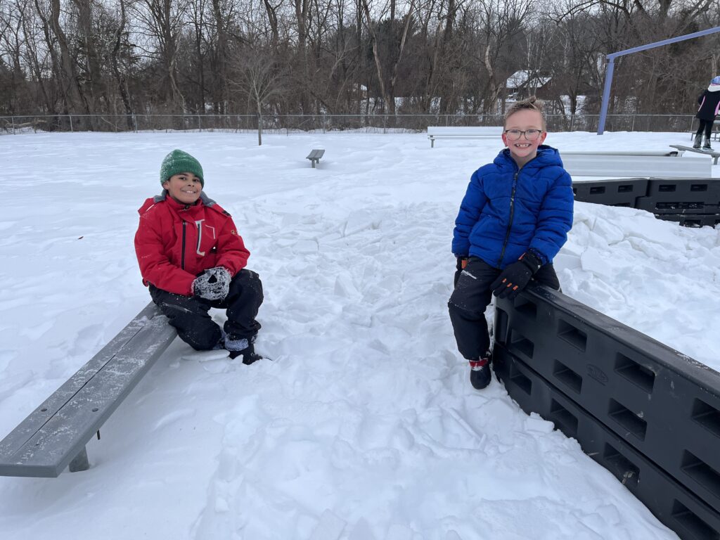 two boys outside in snow
