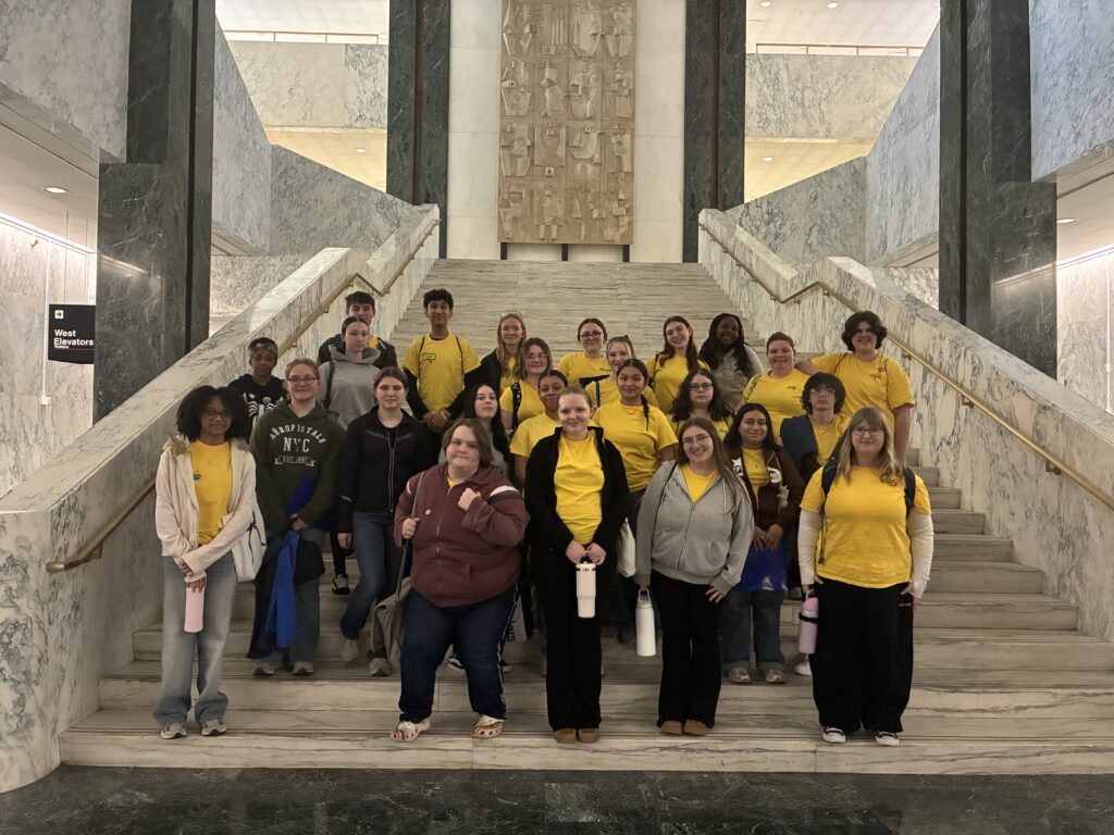 students pose for for group photo on NYS Capitol step